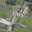 Oblique aerial view of Sandside House and Home Farm, looking to the SE.