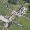 Oblique aerial view of Sandside House and Home Farm, looking to the SE.