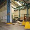 Interior. Central Yard, Steel preparation workshop, West End, South Bay.  Also note the original 1906 stanchions with integral crane rail. The 7.5 Tonne Matterson Electric Overhead Traveller (or EOT, istalled 1995) and two 5 Ton Arrol EOT (Installed 1996) travelled along this. To the left later addition which in parts incorporated the former open yard electric traveller crane rail. This open yard was later closed over and became the steel stockyard.