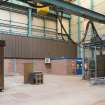 Interior. Central Yard, Steel preparation workshop, North Bay, West End. View of annexe to North West of main shed from South West. One of the two plasma CNC burnres just visible on right. The frame with original 1906 brick infill visible top right corner.