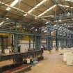 Interior. Central Yard, Steel preparation workshop. General view from North East. The junction between the 1950s extension (nearest the camera) and the original 1906 boiler shop clearly shown. Note the remnants of window voussoirs middle of the image. The wall below has been remodelled.