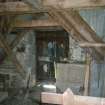 Interior view featuring a door and beams from a Standing Building Survey, Glamis Mill, Glamis, Angus.