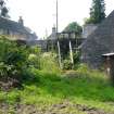 Exterior view showing out-building and sluice from a Standing Building Survey, Glamis Mill, Glamis, Angus.