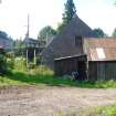 Exterior view of the mill showing an out-building and sluice, from a Standing Building Survey, Glamis Mill, Glamis, Angus.