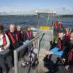 RCAHMS staff and volunteers in boat travelling to St. Serf's Island