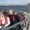 RCAHMS staff and volunteers in boat travelling to St. Serf's Island