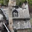 Elevated view from crane, looking down onto fire damaged building.