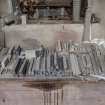 Interior. Former Heron's Mill/Dalmore Mill, first floor, Carpenters Workshop, east wall. Detail of smaller gauge hone stones on workbench.