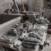 Interior. Former Heron's Mill/Dalmore Mill, first floor, Carpenters Workshop, south wall. Detail of smaller gauge hone stones on workbench.