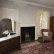 First Floor General view of bedroom 5 showing fireplace and window.