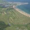 Oblique aerial view of Fraserburgh Golf Course and the town of Fraserburgh in the distance, looking NW.