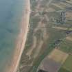 Oblique aerial view of Brora Golf Course, looking S.