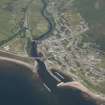 Oblique aerial view of Helmsdale and Helmsdale Harbour, looking NW.