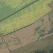 Oblique aerial view of the cropmarks of the settlement, looking SW.