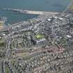 Oblique aerial view of Stranraer town centre and harbour, looking NE.