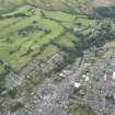 General oblique aerial view of Langholm and the golf course, looking ESE.