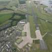 General oblique aerial view of Leuchars Airfield, looking E.
