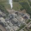 Oblique aerial view of Oxwellmains Cement Works at Dunbar, looking S.