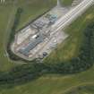 Oblique aerial view of Evanton airfield, looking NE.