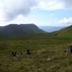 Staff setting up a GPS repeater at the head of Glen Guirdil.
