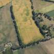 Oblique aerial view of the cropmarks of the unenclosed and palisaded settlements, looking NE.