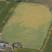 Oblique aerial view of cropmarks of the cursus, enclosures, ring ditches and barrows at Old Montrose, looking SW.