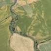 Oblique aerial view of the cropmarks at Drumnagair, looking WSW.