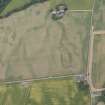 Oblique aerial view centred on the cropmarks of Stracathro Roman temporary camp, looking NE.
