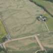 Oblique aerial view of the cropmarks of Strathacro Roman temporary camp, looking NW.
