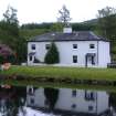 Cullochy Cottages on S bank . South cottage to right of block