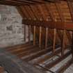 Interior, attic floor, view of roof space from North East.