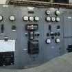 Ground floor, frequency converter control panel. Frequency converter in foreground covered. Late 1970s installation