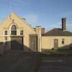 Former training school, view from south west with store rooms on right