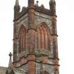 View of upper stages of bell tower, with blind windows.