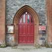 View of main church doorway to base of bell tower.