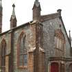 View of pinnacled buttresses to church.