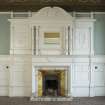 Ground floor, drawing room, view of south wall with fireplace and panelling