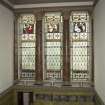 1st floor, staircase, view of stained glass window with panelling below