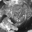 A segment of the concretion surrounding the sword-hilt (DP92/178) retains impressions of its original decoration, including the face of a putto or cherub. (Colin Martin)