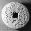 Rotary grindstone (DP92/DG13) with square spindle-hole, opposite face. Scale 25 centimetres. (Colin Martin)
