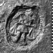 	Stamp on the lead 4-pound merchant's weight (DP97/A021). It shows the Archangel Michael weighing souls in the balance, and is the mark of the Worshipful Company of Plumbers, London. Scale in millimetres. (Colin Martin)