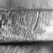 Detail of the edge of the lead 4-pound merchants’ weight (DP97/A021) showing file marks, presumably cut to bring the weight to the correct value. The actual weight is almost exactly 4 pounds avoirdupois. (Colin Martin)