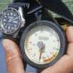 The two primary instruments with which the diver monitored his dive—a bezel watch and a metric depth-gauge. (Edward Martin)