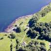 Aerial photograph of the kiln complex at Port Kilcheran from the N. The quarry face is beneath the line of trees facing the sea. The former seminary, now Kilcheran House, is at bottom right. (Colin Martin)
