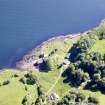 Aerial photograph of the kiln complex at Port Kilcheran from the N. The quarry face is visible beneath the line of trees facing the sea. The former seminary, now Kilcheran House, is at bottom right. (Colin Martin)