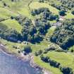 Aerial photograph of the kiln complex at Port Kilcheran from the NE. The quarry face is beneath the line of trees facing the sea. The former seminary, now Kilcheran House, is upper right of centre. (Colin Martin)