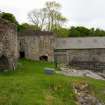 Kiln B and its fronting shed are seen to the rear, while the E face of Kiln A with its draw-arch are in the left foreground. (Colin Martin)