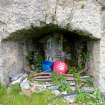The SE draw-arch of the left-hand pot of Kiln B. Evidence of harling is visible round the arch, and its rear wall is covered with lime residues. (Colin Martin)