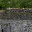 The upper rear SE face of the main kiln building showing structural features indicative of a bridge linking its upper level with Kiln A. Scale 2 metres. (Colin Martin)