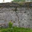 The S face of Kiln A showing the roof raggles of two phases of lean-to structures, and extensive areas of harling. The upper stonework shows no evidence of harling and may be a later phase. Scale 2 metres. (Colin Martin)